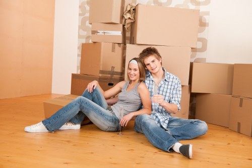 Movers loading boxes and furniture for a South Croydon home removal